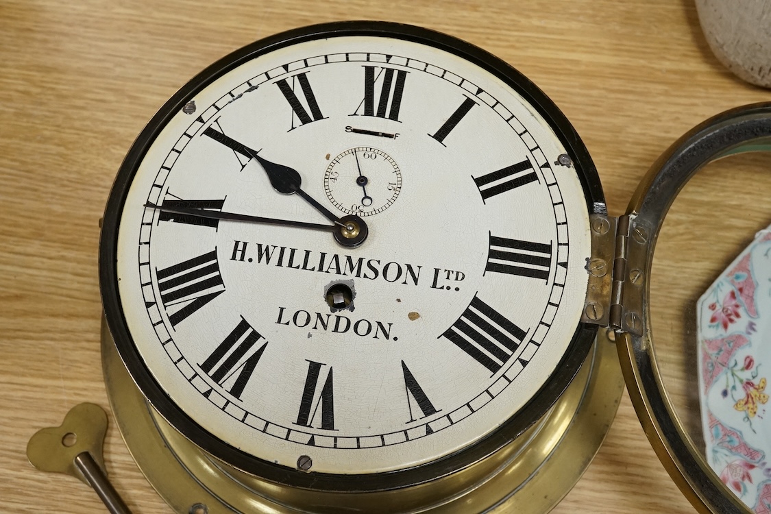 H Williamson Ltd, London, brass ships bulkhead timepiece with key, 28cm in diameter